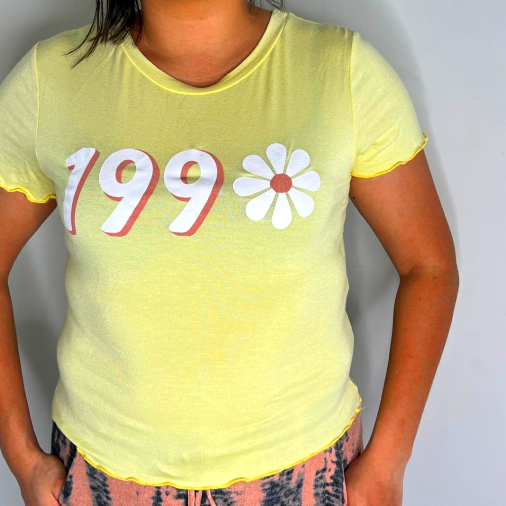 Blue Rain brand blouse, yellow color, with flower detail and number on the front